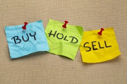 sticky notes with Buy, Hold, and Sell written on them