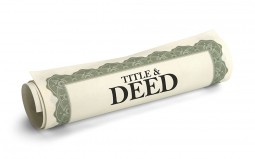 Wrapped up contract with the word Title & Deed on it